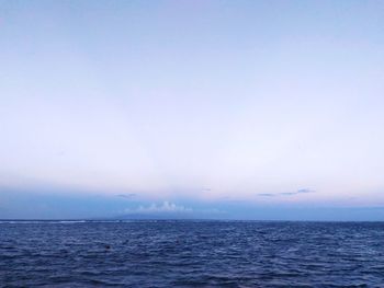 Scenic view of sea against blue sky