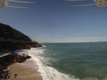 Scenic view of sea against clear sky