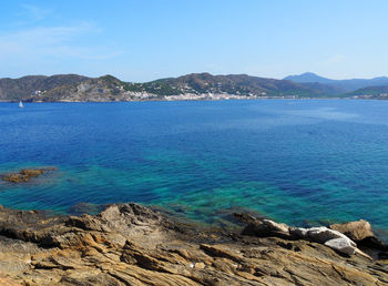 Scenic view of sea against blue sky