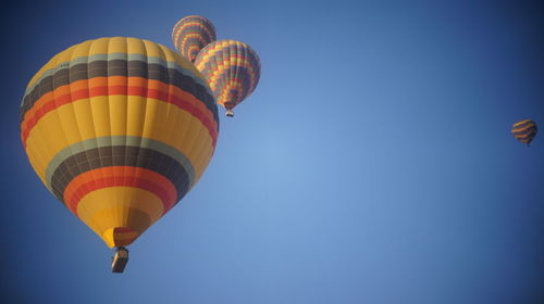 Low angle view of hot air balloons against sky