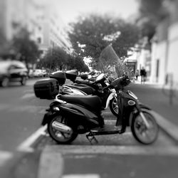 Close-up of motorcycle on road