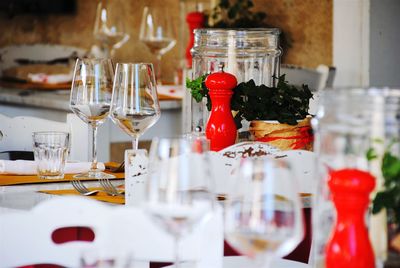 Close-up of wineglasses on table