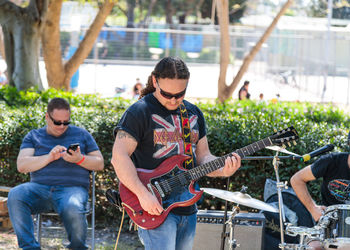 Full length of man playing guitar