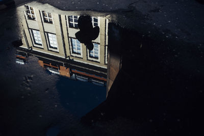 High angle view of canal by buildings in city