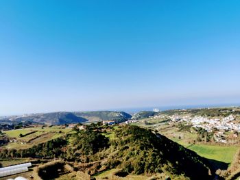 High angle shot of townscape against clear blue sky