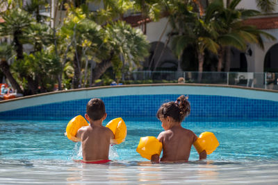 People enjoying in swimming pool