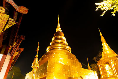 Low angle view of illuminated historic building against sky at night