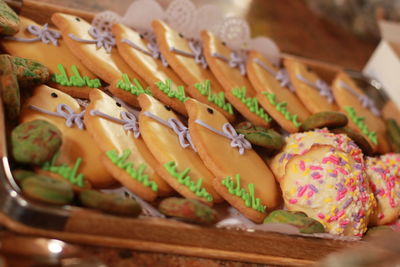 Close-up of multi colored cookies in tray