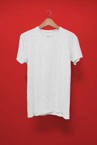 White decoration hanging against red background