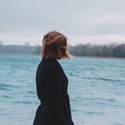 Rear view of woman looking at sea