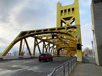 Bridge against sky in city