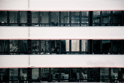 Business building with dark windows and empty working spaces