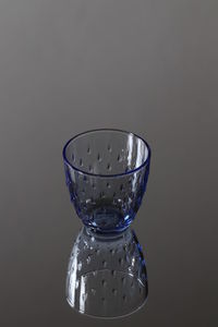 Close-up of glass of water against black background