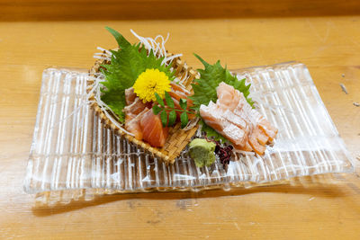 High angle view of fresh vegetables in plate on table