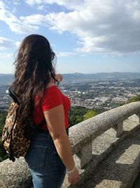 Side view of young woman looking at view