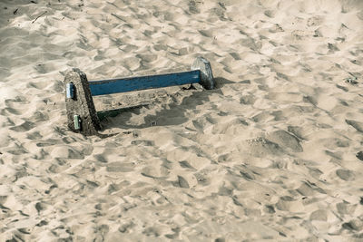 Chair on sand at beach