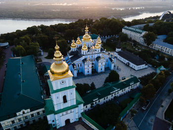 High angle view of statue amidst buildings in city