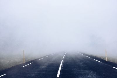 Road in foggy weather during winter