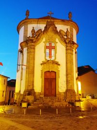 Facade of church against clear blue sky