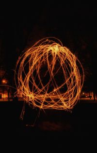 Light trails against sky at night