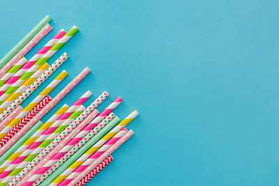 Directly above shot of felt tip pens on blue background