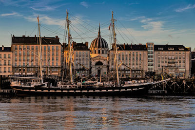 View of bridge over river with buildings in background