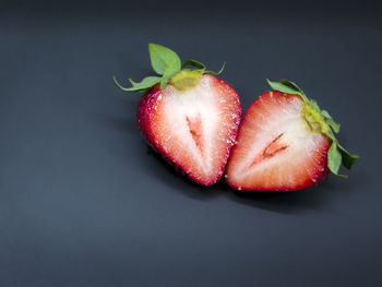 Close-up of strawberry over black background