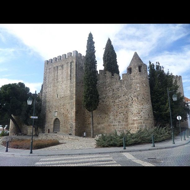 architecture, built structure, building exterior, sky, history, transfer print, auto post production filter, low angle view, the past, old, cloud - sky, cloud, sunlight, place of worship, ancient, religion, day, old ruin, castle, stone wall