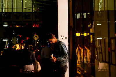 People standing in restaurant at night