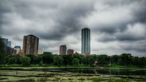 City skyline against cloudy sky