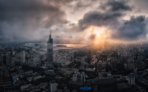 High angle view of city at sunset