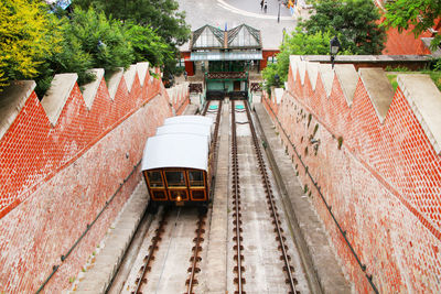 High angle view of train amidst buildings