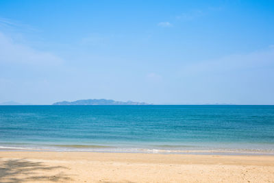 Scenic view of sea against blue sky