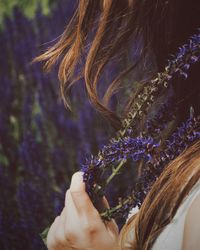 Close-up of woman hand holding flowers