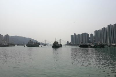 Panoramic view of sea and buildings against clear sky