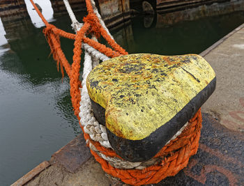 High angle view of rope tied at harbor