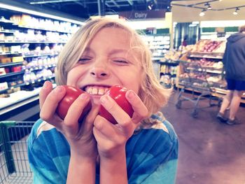 Close-up of girl eating ice cream at store