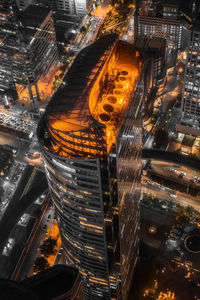 High angle view of illuminated buildings in city