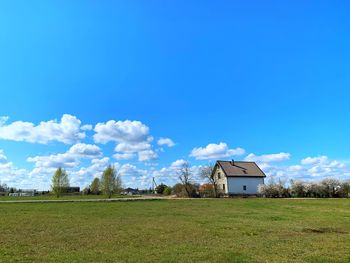 House on field against sky