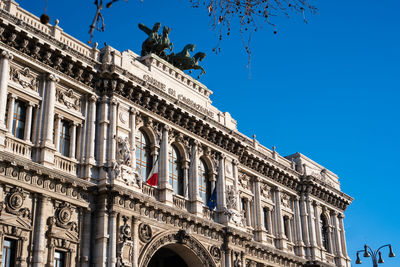 Low angle view of building against clear blue sky