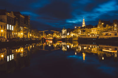 Reflection of buildings in water at night