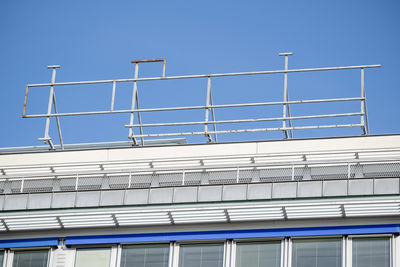 Low angle view of building against clear blue sky