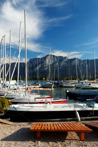 Boats moored at harbor at wörthersee lake