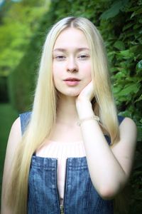 Portrait of beautiful young woman with long blond hair
