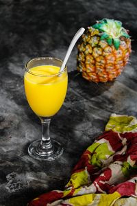 Close-up of yellow juice on table