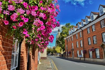 View of street amidst buildings against sky