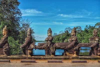 Statue of temple against cloudy sky