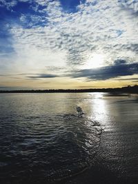 Scenic view of sea against sky at sunset