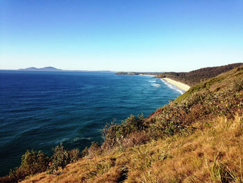 Scenic view of sea against clear blue sky