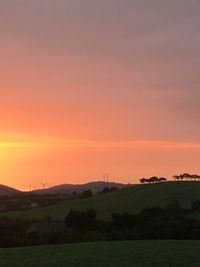 Scenic view of landscape against sky during sunset